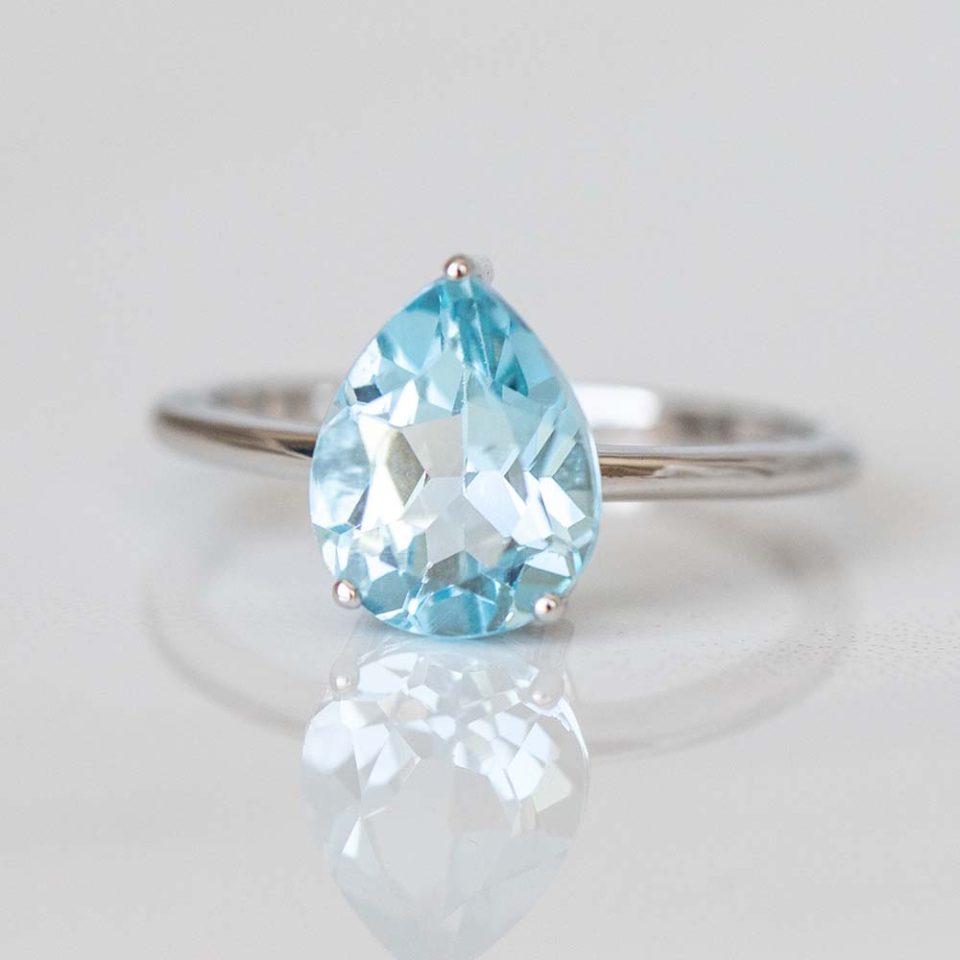 Ring with 8X10MM Pear Blue Topaz in 10kt White Gold - Paris Jewellers