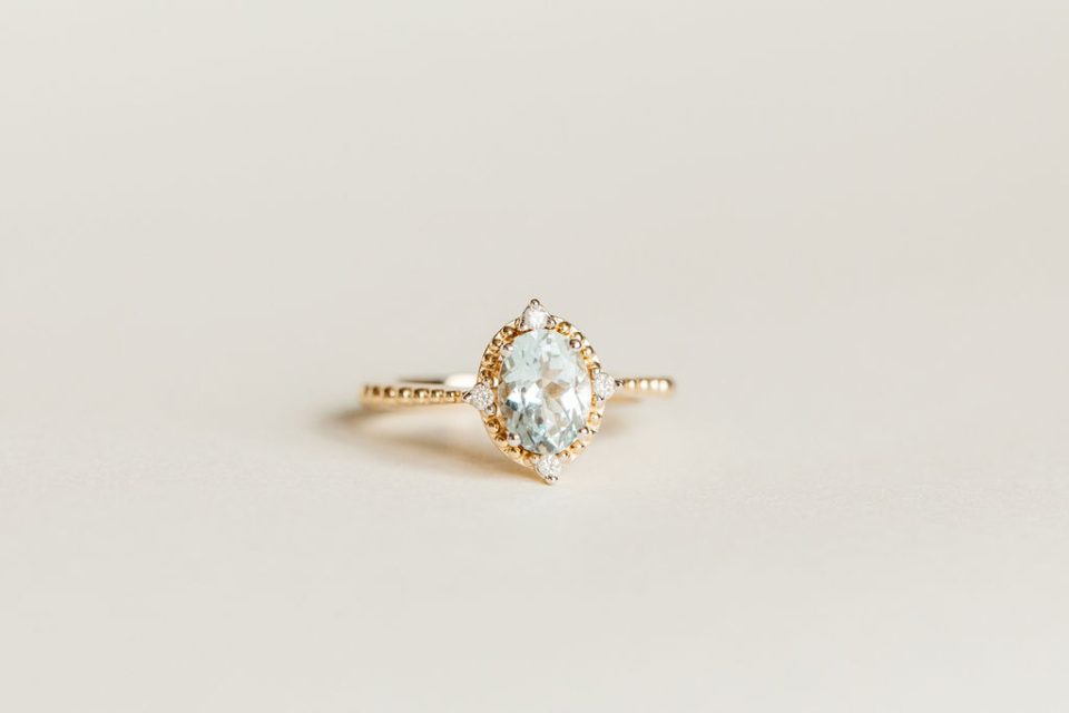 Ring with 8X6MM Oval Aquamarine and .05 Carat TW of Diamonds in 14kt Yellow Gold