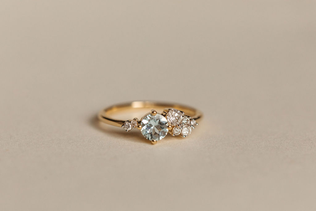 Ring with 5MM Aquamarine and .20 Carat TW of Diamonds 14kt Yellow Gold