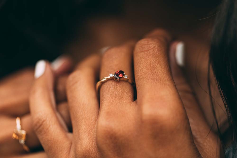 Ring with 4X6MM Oval Garnet and .06 Carat TW of Diamonds 10kt Yellow Gold