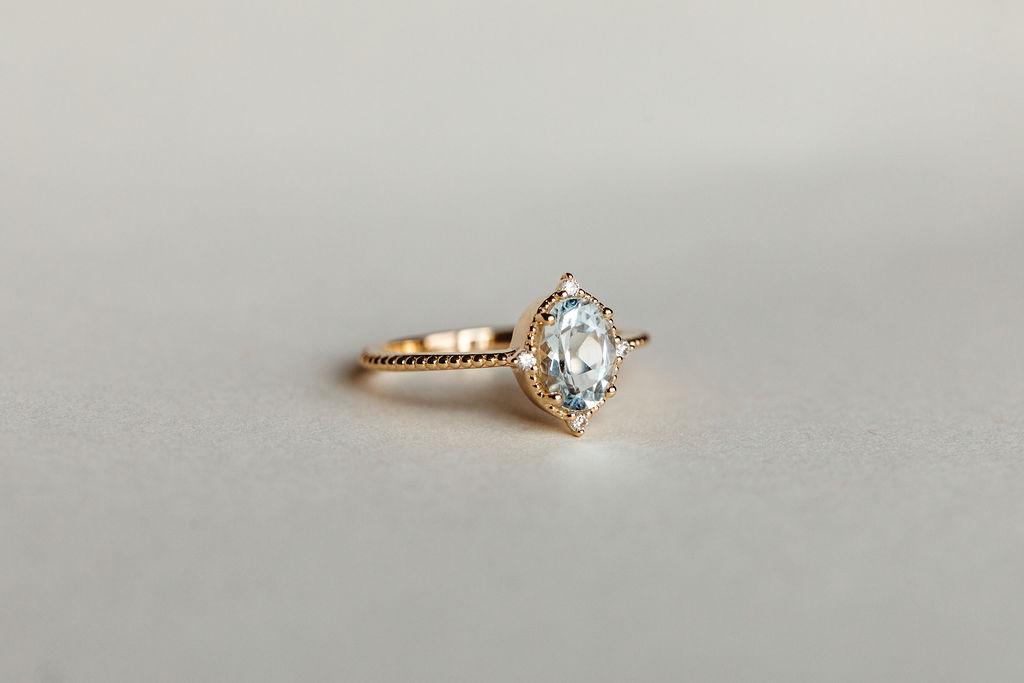 Ring with 8X6MM Oval Aquamarine and .06 Carat TW of Diamonds in 10kt Yellow Gold