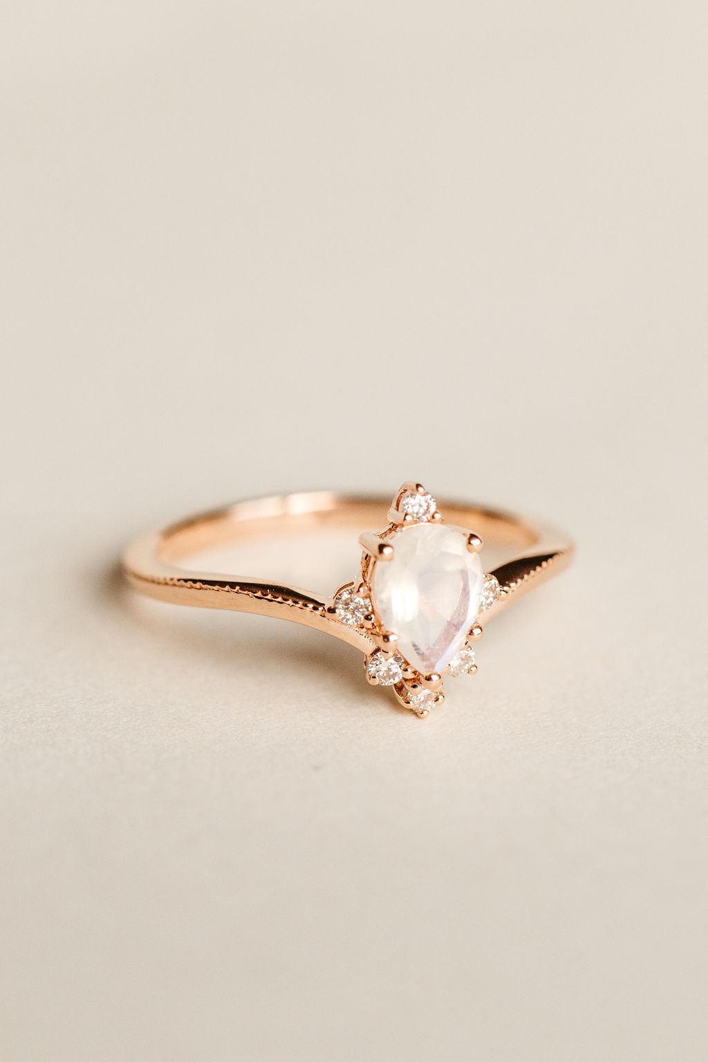 Ring with 7X5MM Pear Shape Rainbow Moonstone and .12 Carat TW of Diamonds in 10kt Rose Gold