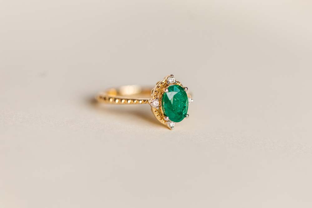 Ring with Oval 8X6MM Emerald and .05 Carat TW of Diamonds in 14kt Yellow Gold