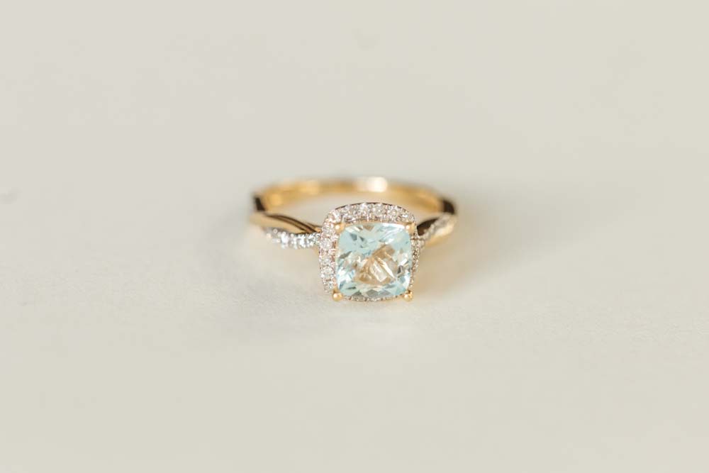 Ring with Cushion Cut 7MM Aquamarine and .30 Carat TW of Diamonds in 14kt Yellow Gold