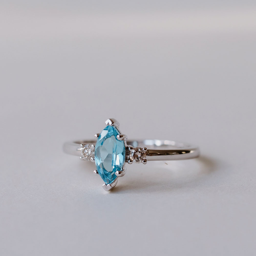 Ring with 8X4MM Marquise Blue Topaz and .08 Carat TW of Diamonds 14kt White Gold