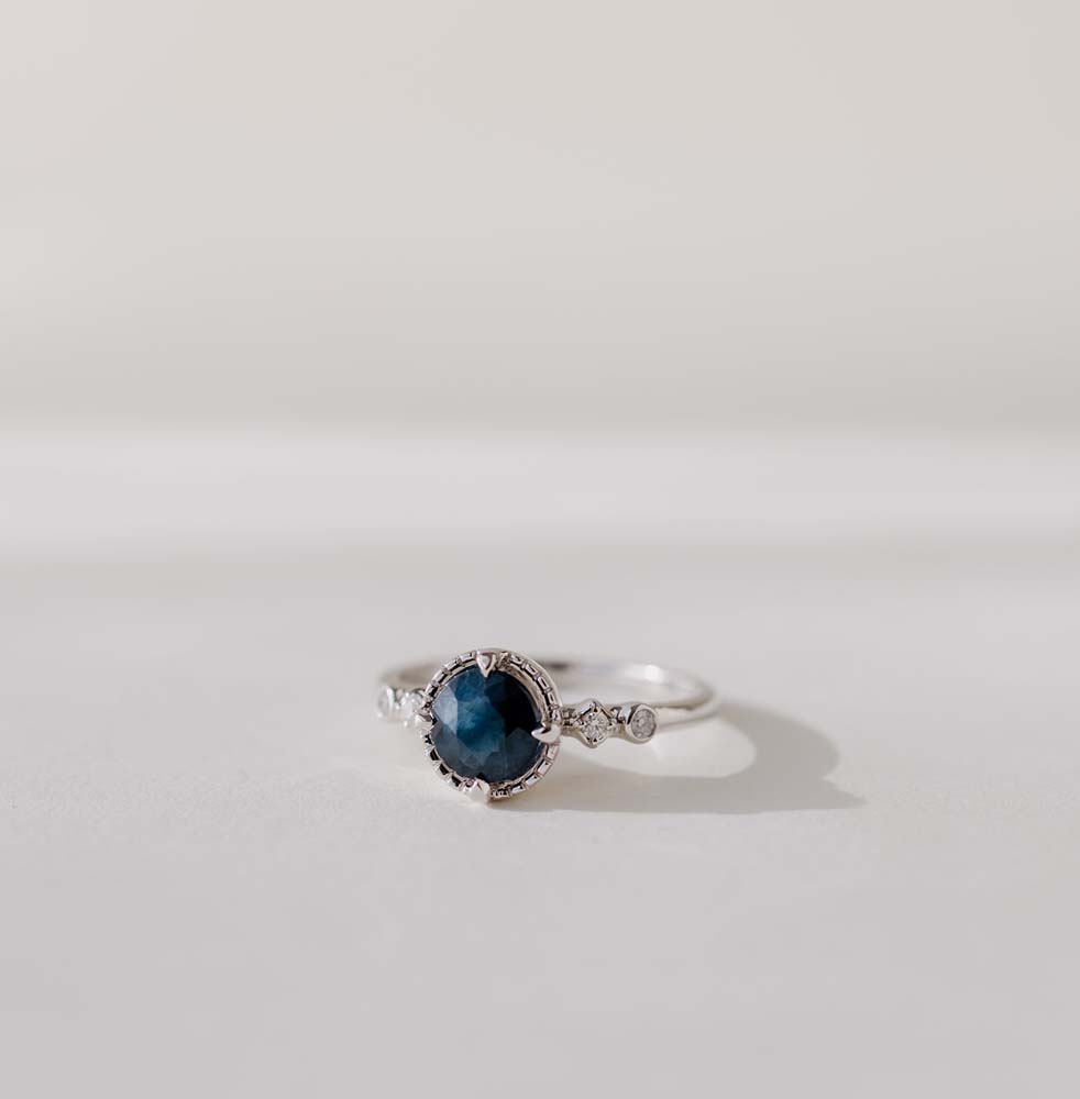 Ring with 6MM Round Blue Sapphire and .05 Carat TW of Diamonds 14kt White Gold