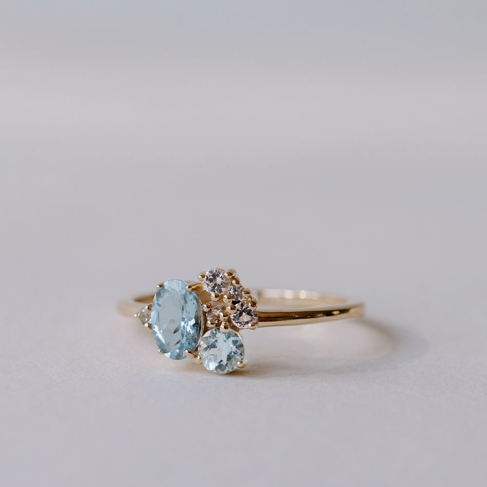 Ring with 6X4MM Oval Blue Topaz, Round Aquamarine and Blue Topaz in 10kt Yellow Gold