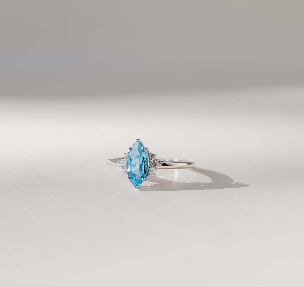 Ring with 9X5MM Marquise Cut Swiss Blue Topaz and .10 Carat TW of Diamonds in 14kt White Gold