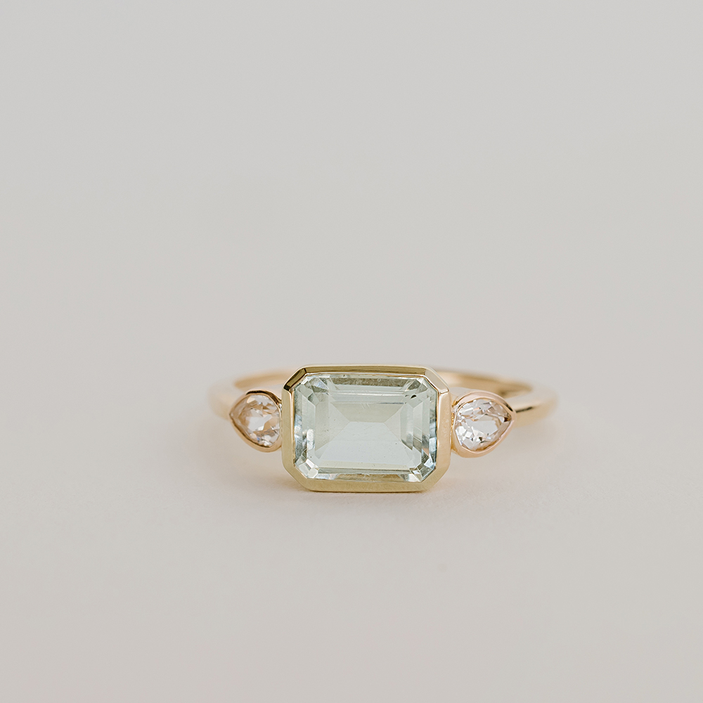 Ring with 8X5MM Emerald cut, Green Amethyst, & Pear Shaped White Topaz 10kt yellow gold