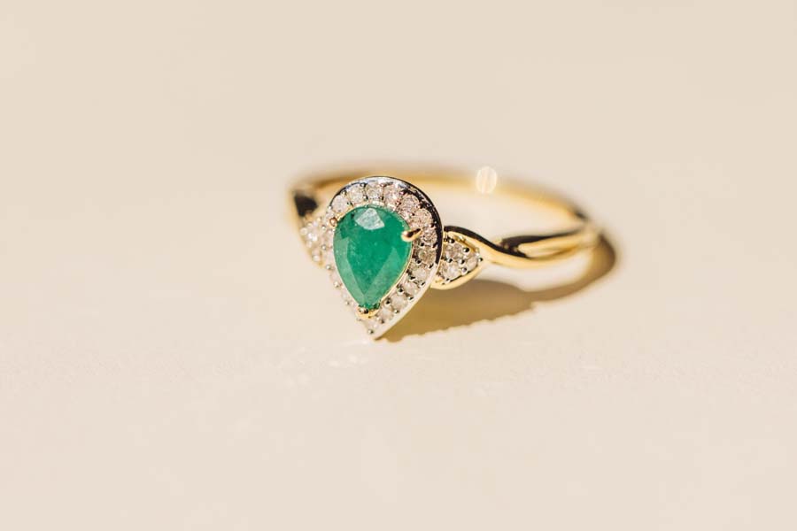 Halo Ring with .17 Carat TW of Diamonds and 7x5MM Pear Shape Emerald in 10kt Yellow Gold