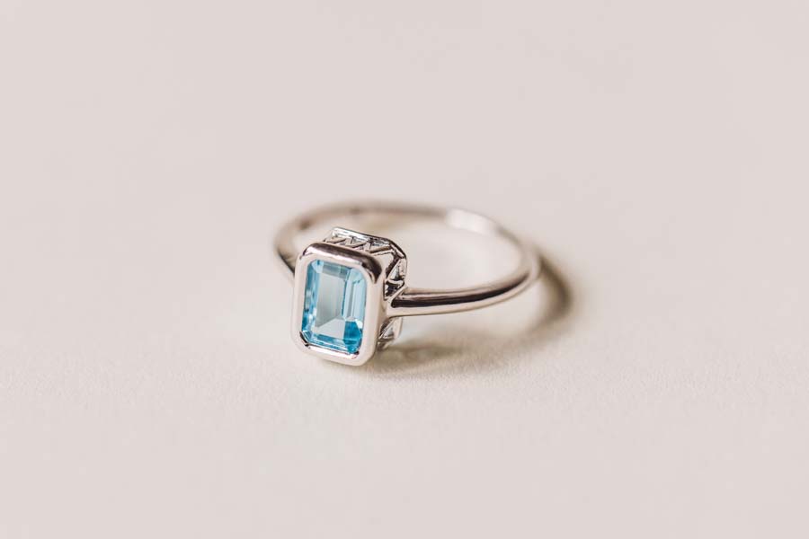 Ring with 7x5MM Emerald Cut Blue Topaz in 10kt White Gold