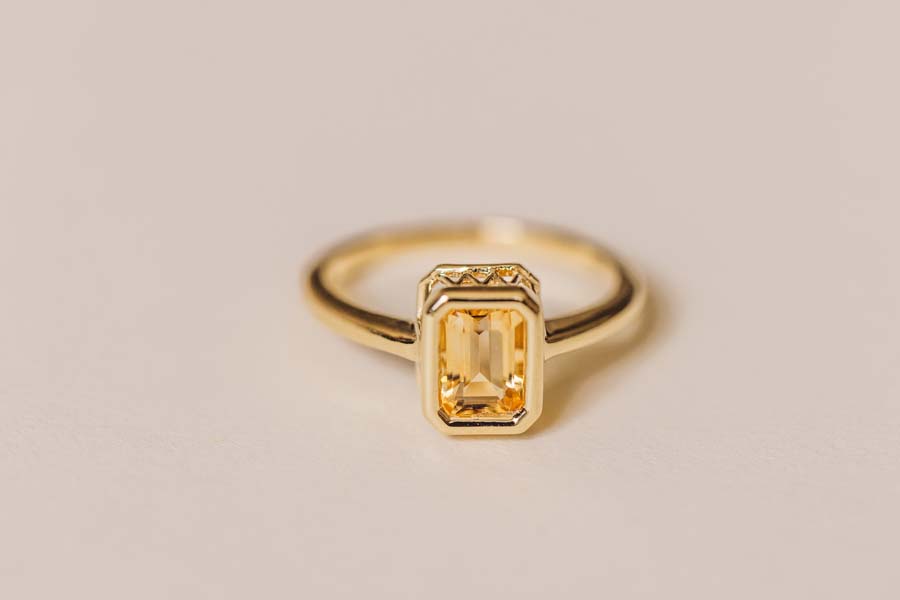 Ring with 7x5MM Emerald Cut Citrine in 10kt Yellow Gold