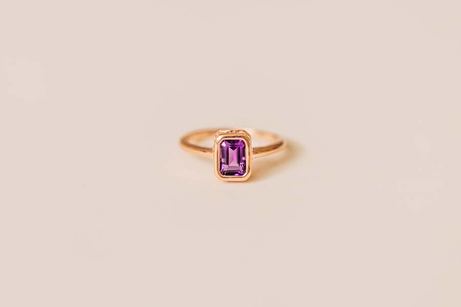 Ring with 7x5MM Emerald Cut Amethyst in 10kt Rose Gold