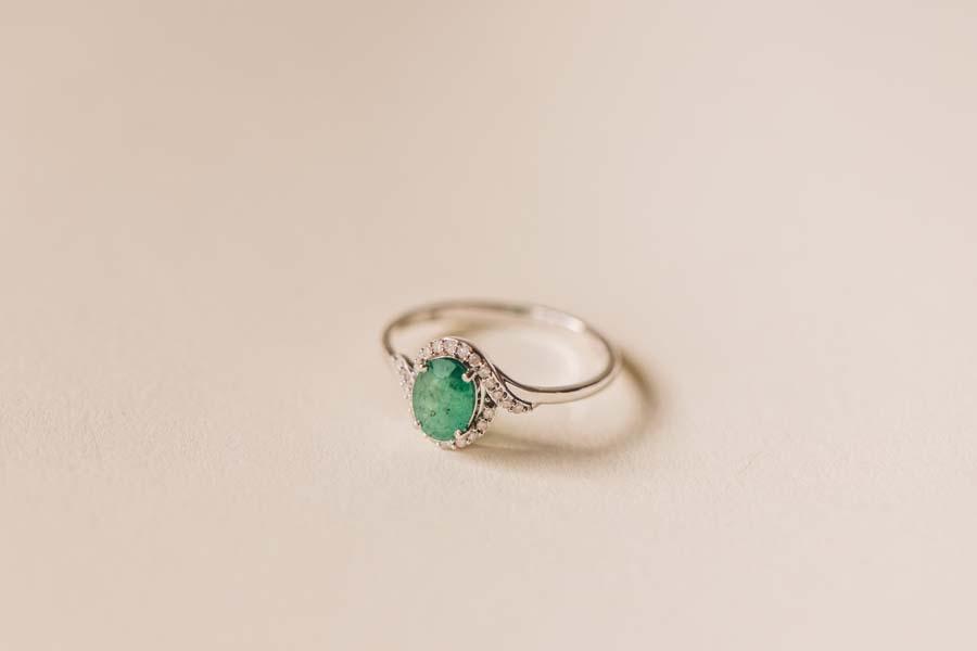 Halo Ring with .10 Carat TW of Diamonds and 7x5MM Oval Emerald in 10kt White Gold