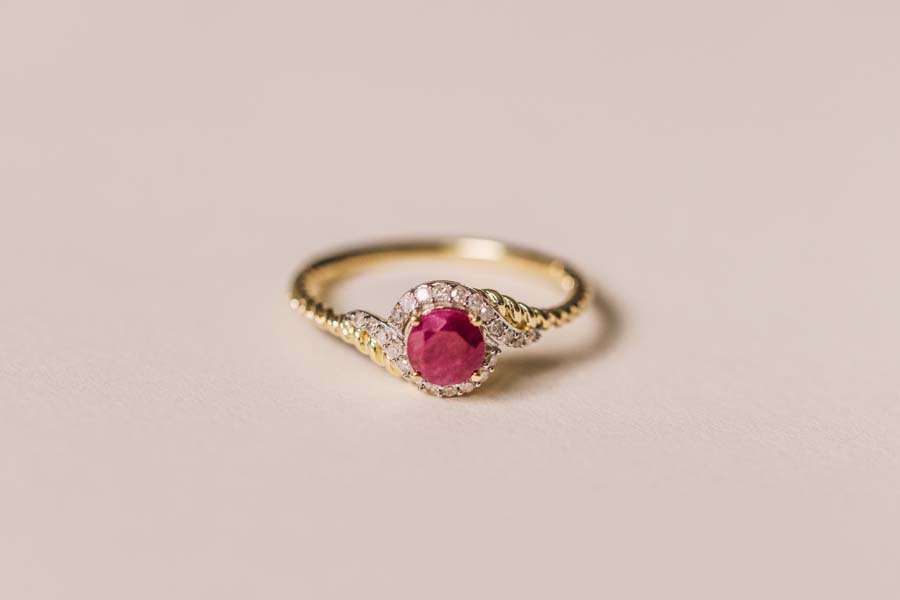 Halo Ring with .10 Carat TW of Diamonds and 5MM Ruby in 10kt Yellow Gold