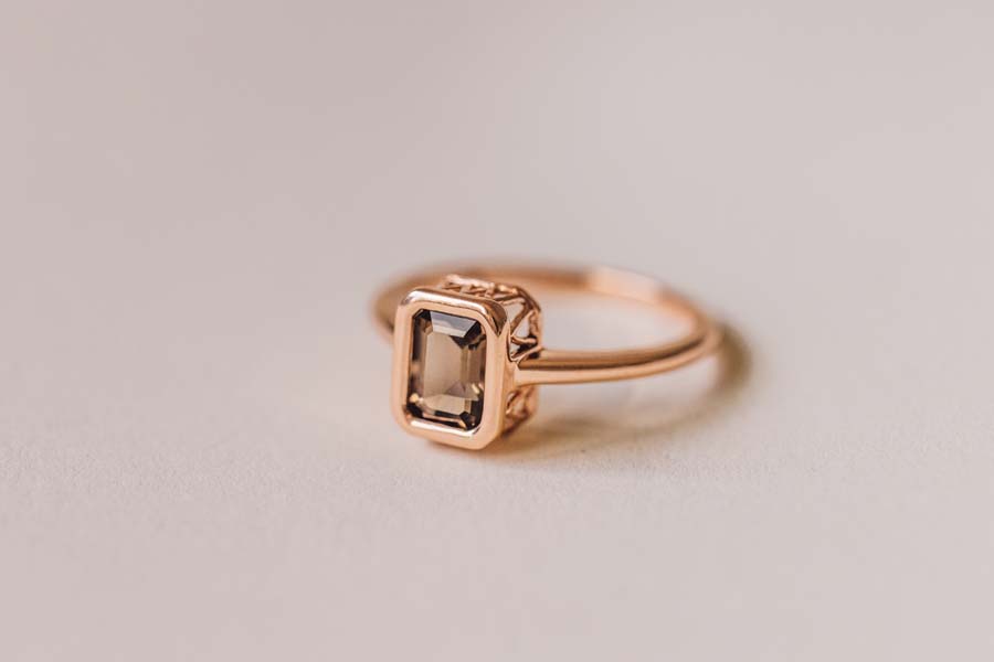 Ring with 7x5MM Emerald Cut Smoky Quartz in 10kt Rose Gold