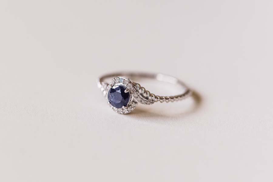 Halo Ring with .10 Carat TW of Diamonds and 5MM Blue Sapphire in 10kt White Gold