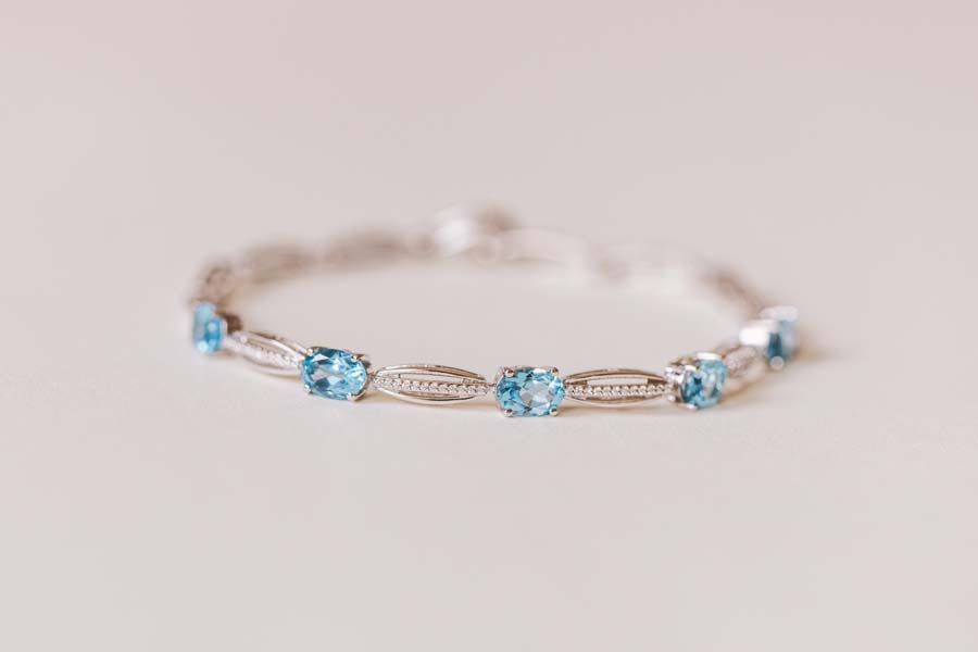 7.5" Tennis Bracelet with 7x5MM Blue Topaz and Cubic Zirconia in Sterling Silver