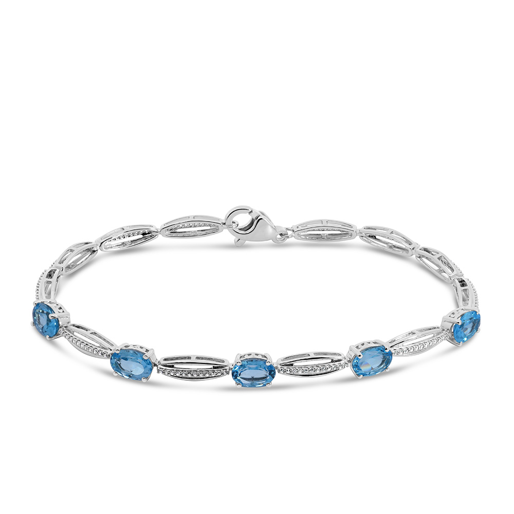 7.5″ Tennis Bracelet with 7x5MM Blue Topaz and Cubic Zirconia in Sterling Silver